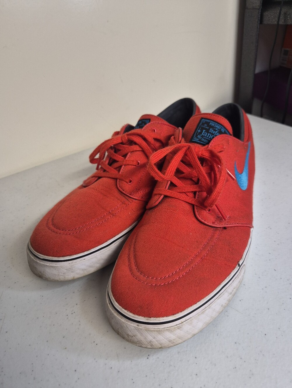 Nike Men’s Red Canvas Sneakers with Blue Swoosh